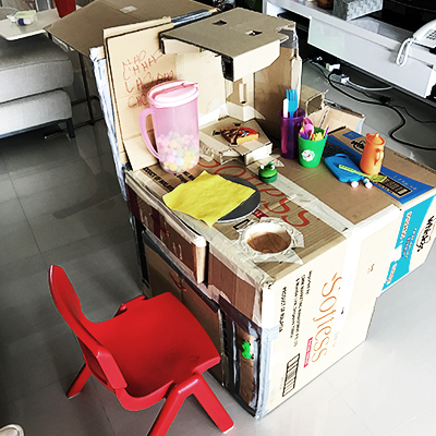 Kids decorating their cardboard café